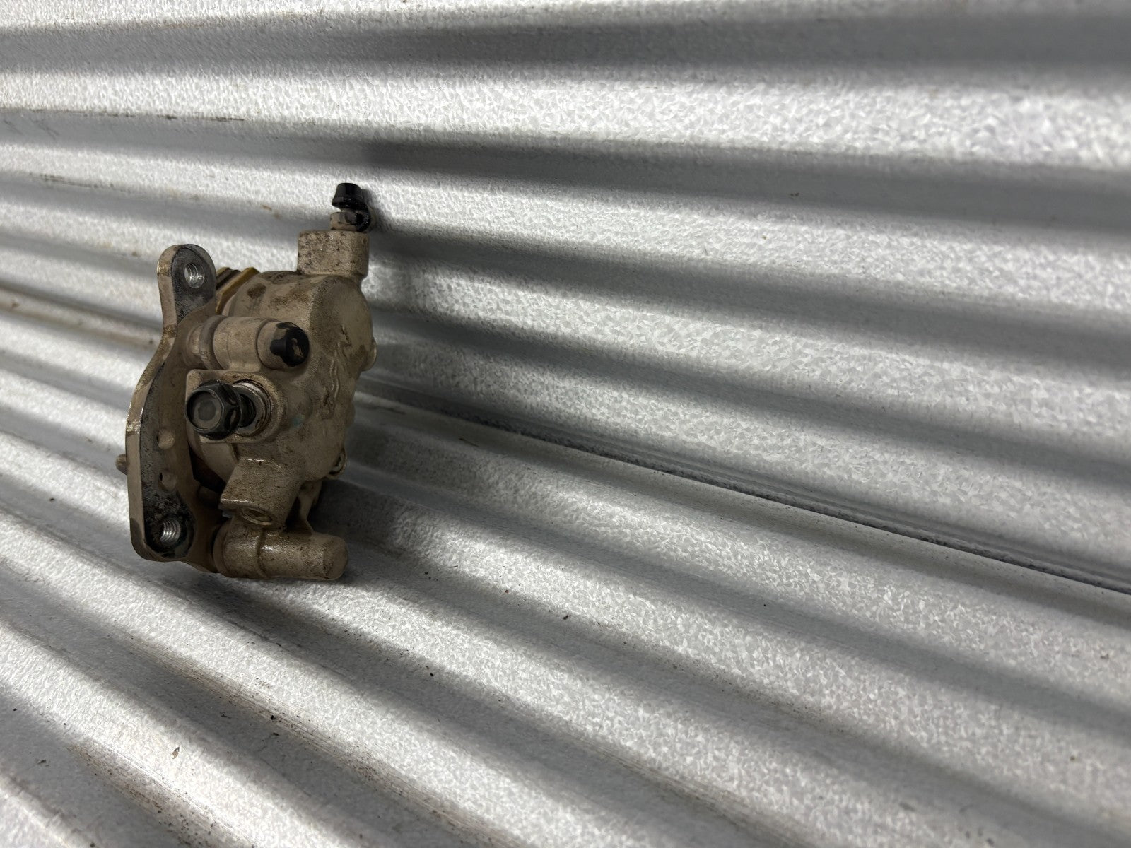 2010 Kawasaki Teryx 750 Left Front Brake Caliper OEM 43080-0083